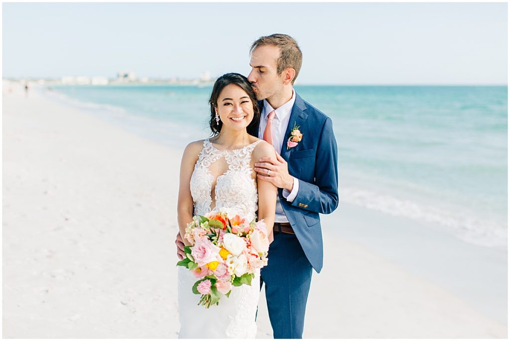 Bride and groom on the beach in Sarasota Florida  | By Sarasota Wedding Photographer, Nikki Golden