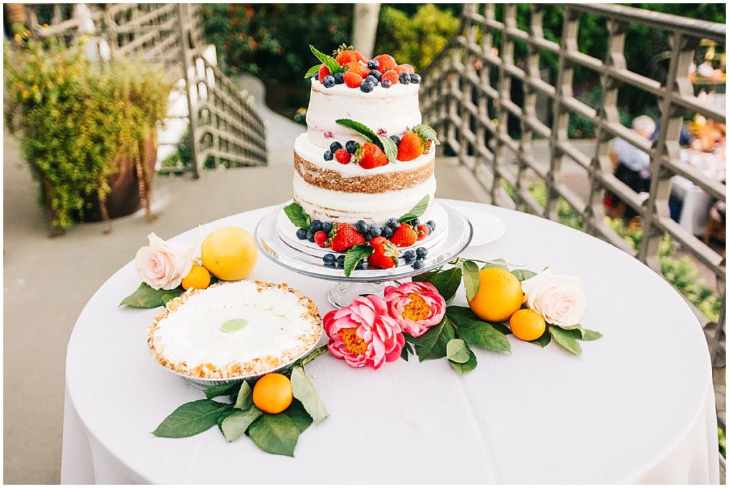 Wedding cake with strawberries and citrus fruit  | By Sarasota Wedding Photographer, Nikki Golden