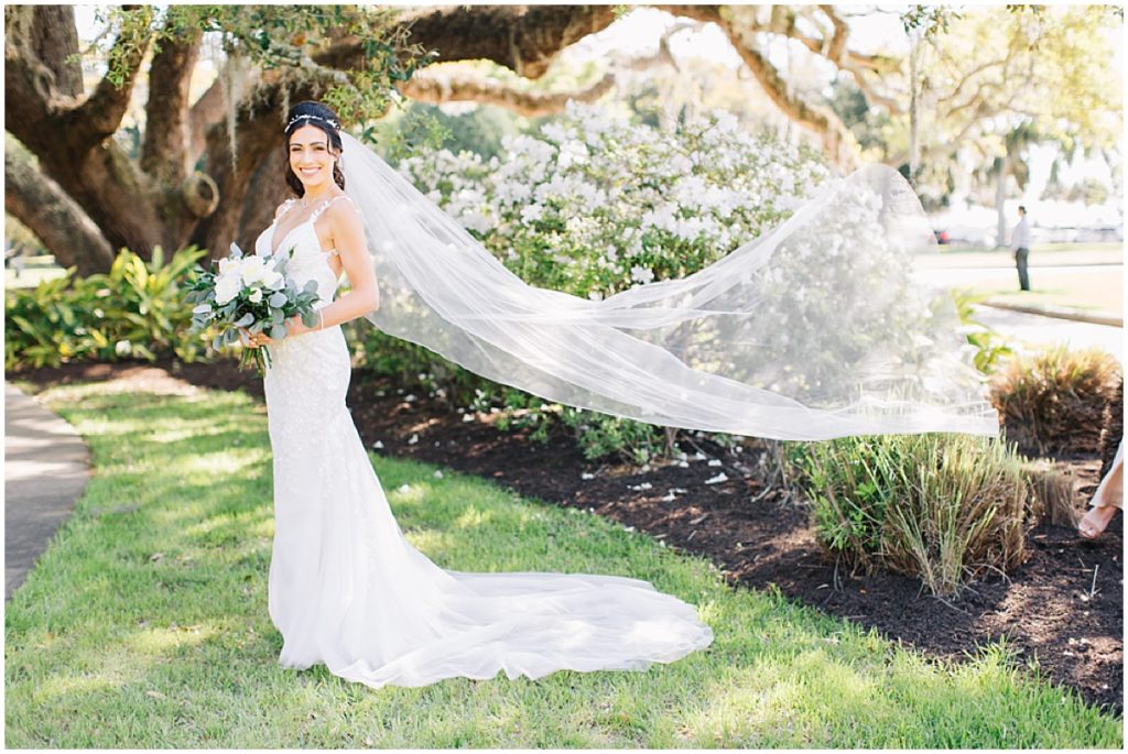 Bride at with flowing veil and white and green bouquet  | By Jekyll Island Wedding Photographer, Nikki Golden