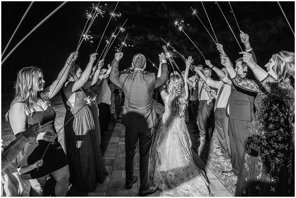 Wedding reception sparkler send off at Tuscan Rose Vineyards. Black and white image.