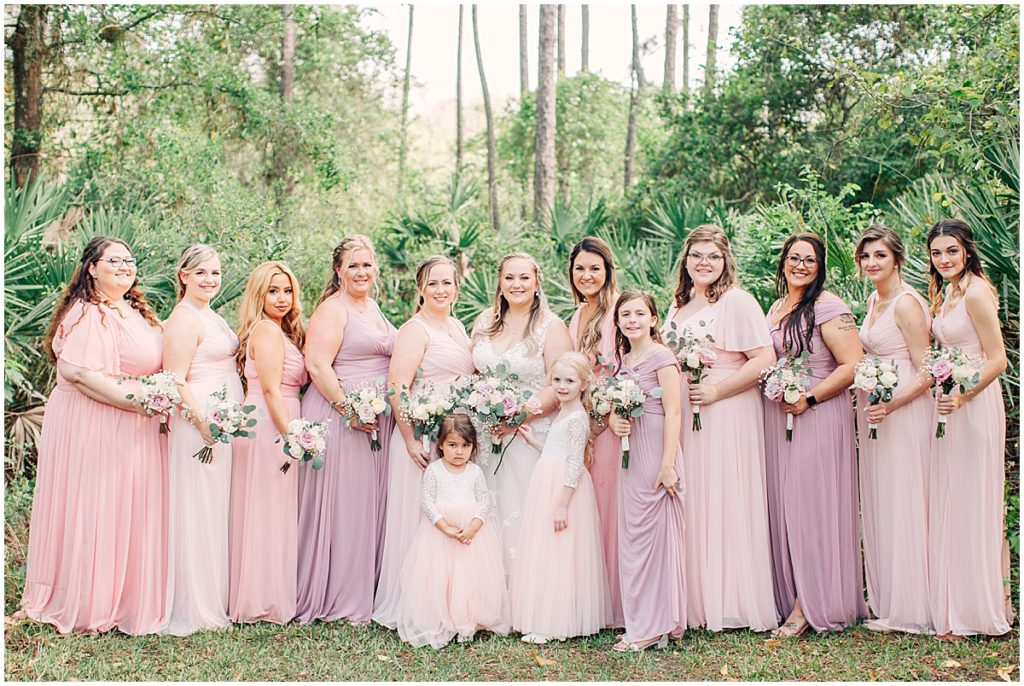 Bride with bridesmaids in dusty pink colors | By Jacksonville Wedding Photographer, Nikki Golden