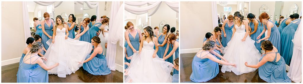 Bride with bridesmaids tending to her dress