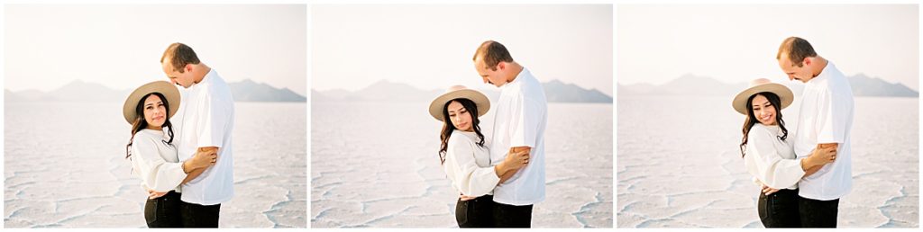 Couple wearing white tops and black bottoms, girl wears at hat at couples photography session at Utah Salt Flats by Nikki Golden, Fine art Photographer