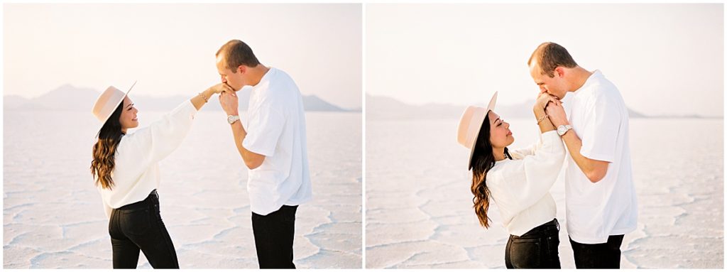 Man kissing woman's hand at Utah Salt Flats
