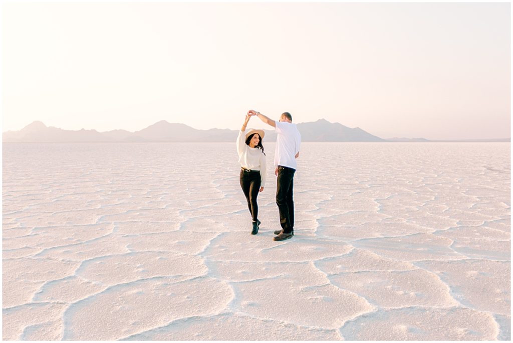 Man and woman dancing at the Bonneville salt flats in Utah | Film Wedding Photographer