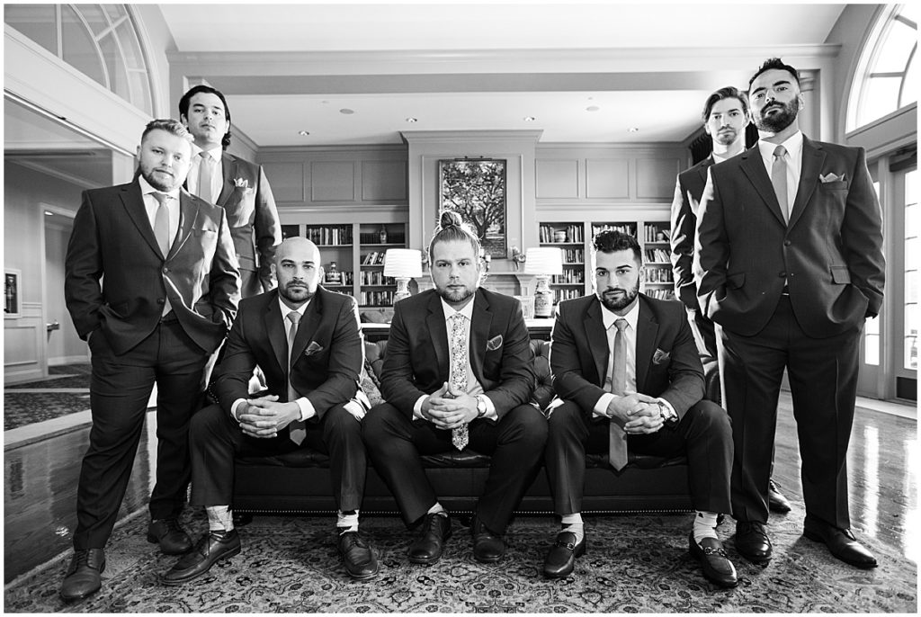 Black and white image of groom with groomsmen | St Augustine wedding photographer | Nikki Golden