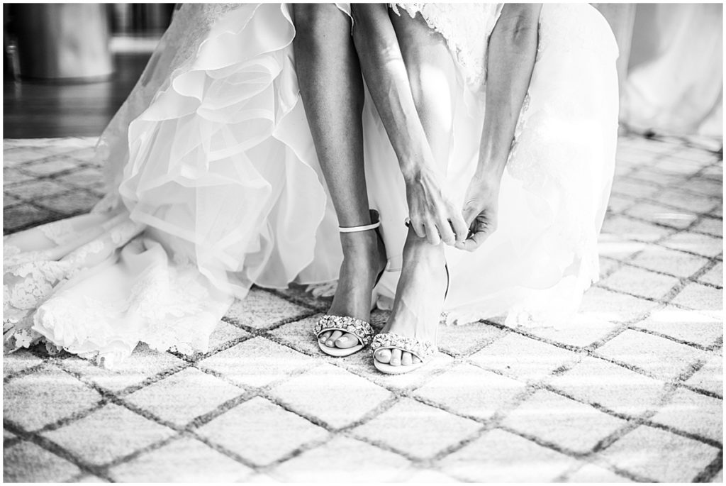 Black and white image of bride getting ready for Atlanta wedding