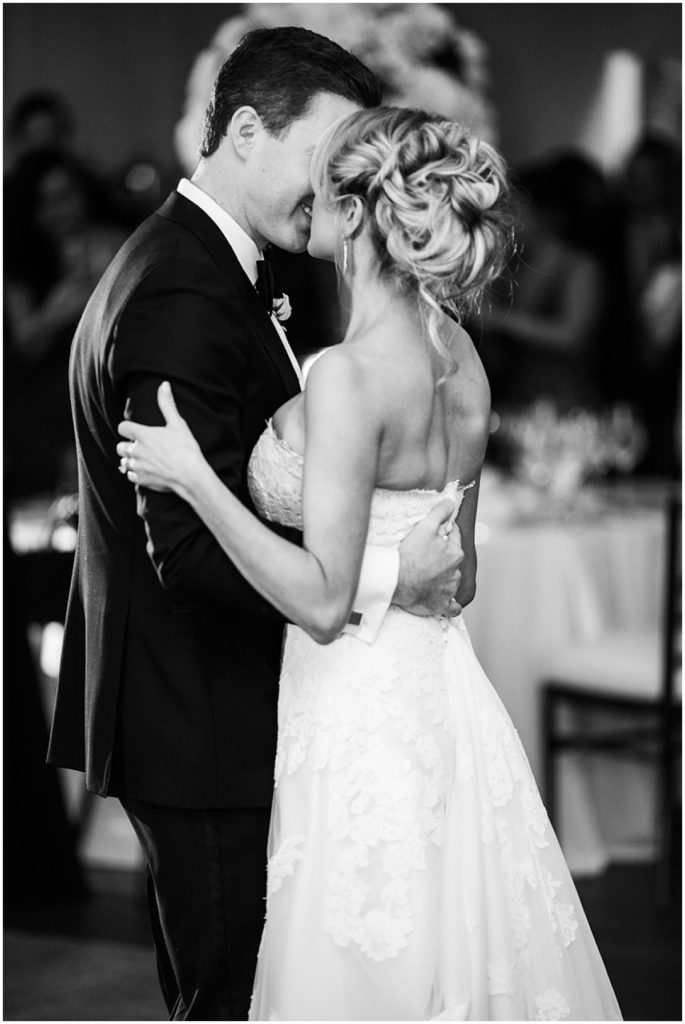 Black and white image of bride and groom's first dance at wedding reception at The Estate, Atlanta. Nikki Golden Photography