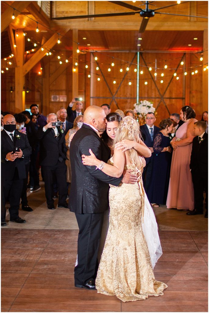 A tender moment with bride and groom with mother in law at wedding reception | Nikki Golden Photography 