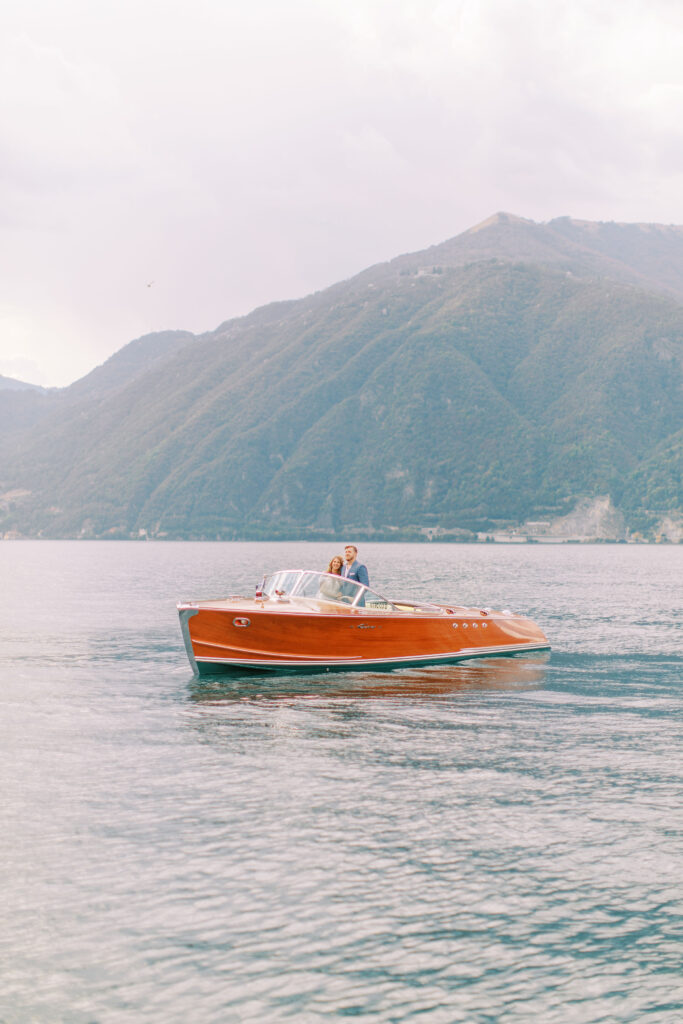 Bride and groom sitting on a boat in lake como italy