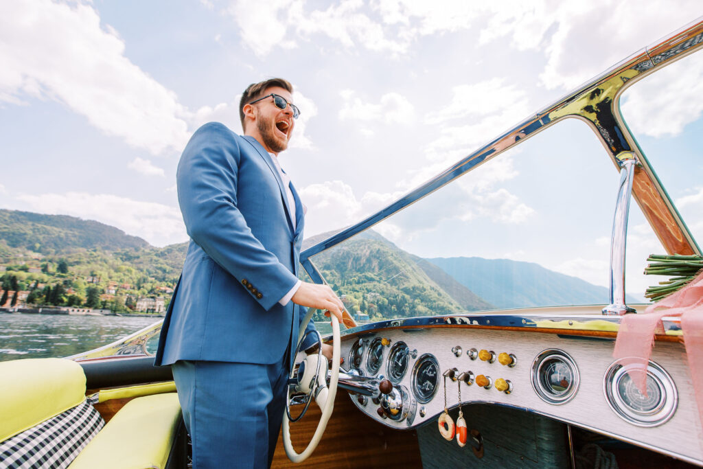 groom driving a boat in lake como italy