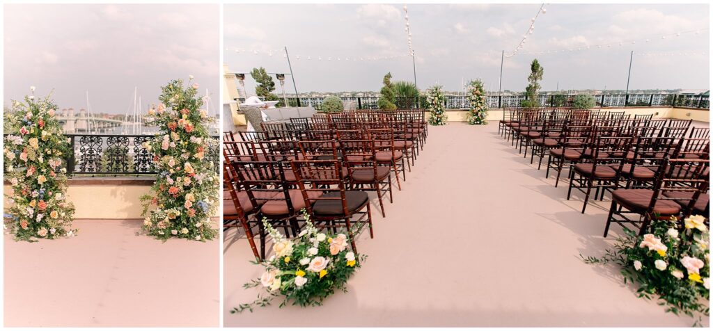 Wedding ceremony space on a rooftop with chairs and florals throughout