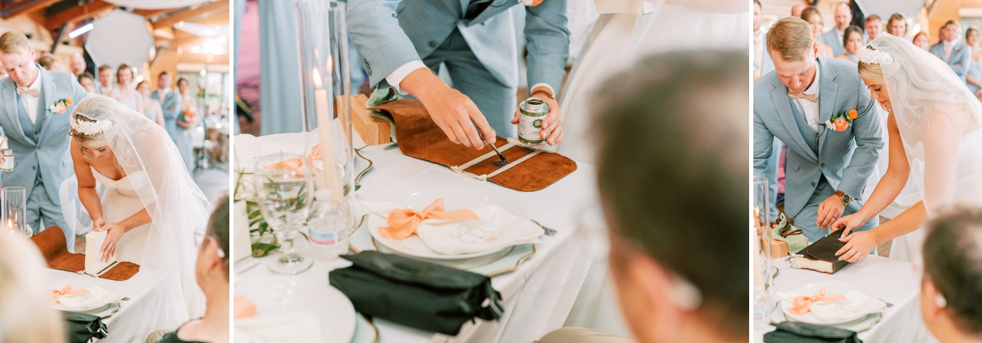 A couple binding a Bible together during their wedding ceremony 