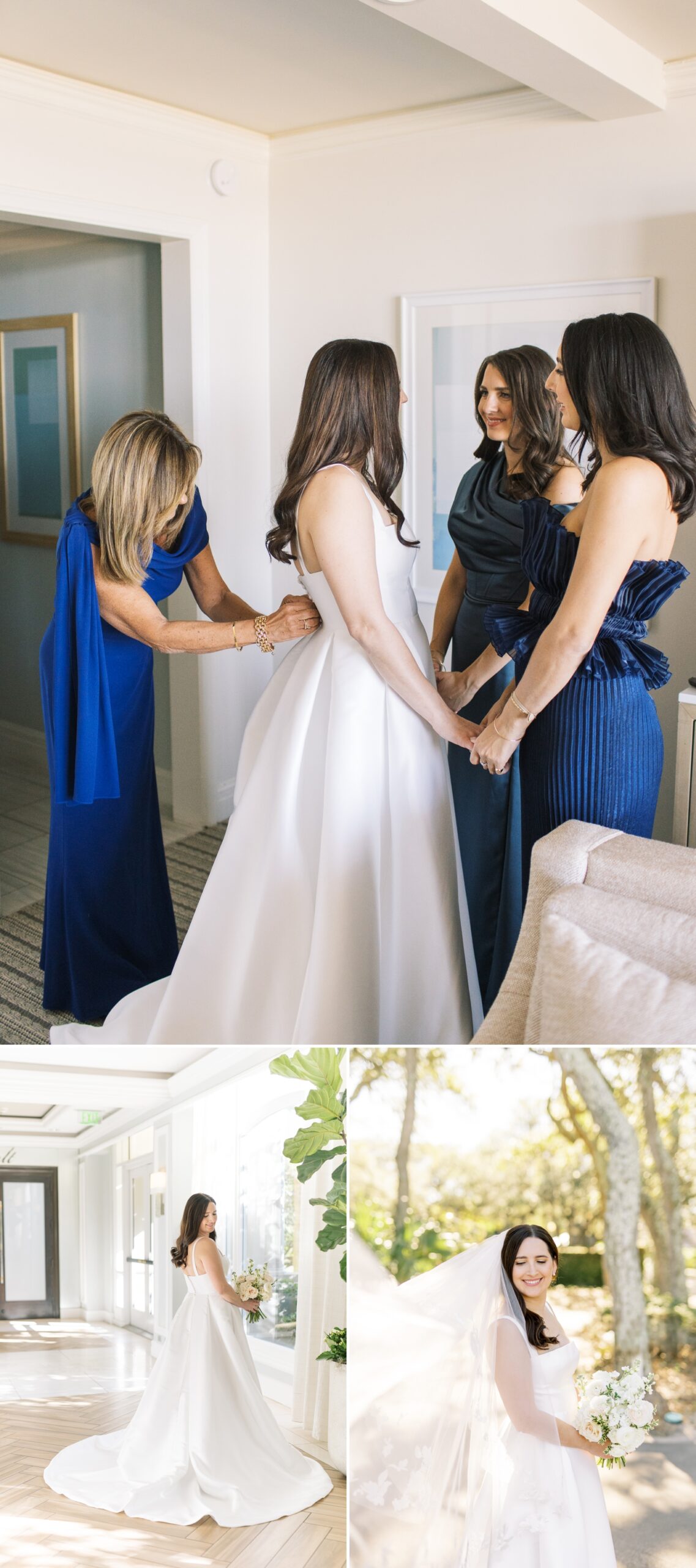 Bride holding hands of two bridesmaids in Navy Blue dresses while her mother zips up her dress